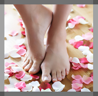 feet surrounded by petals